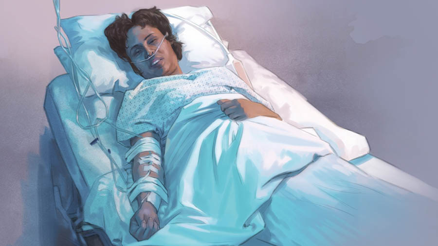 ’n Vrou lê in ’n hospitaalbed. Sy kry suurstof en is gekoppel aan ’n drup.