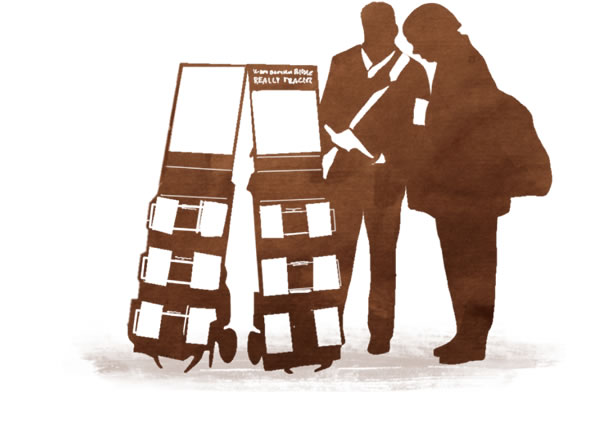 شاهد ليهوه يبشِّر رجلا يقف بجانب واجهة متحرِّكة تُستخدم في الشهادة العلنية