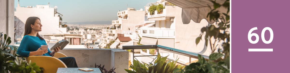 Lesson 60. A woman sits on her balcony and reads the Bible. The book ‘Draw Close to Jehovah’ is on a table beside her.