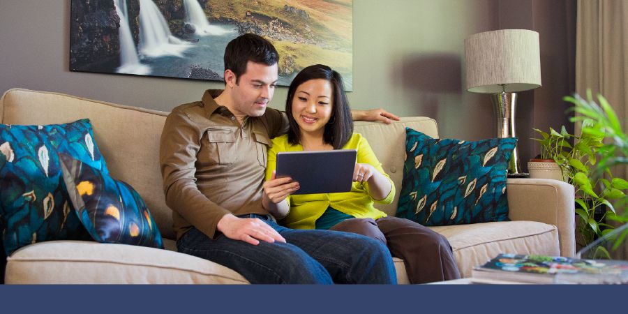 A couple studying on their tablet together