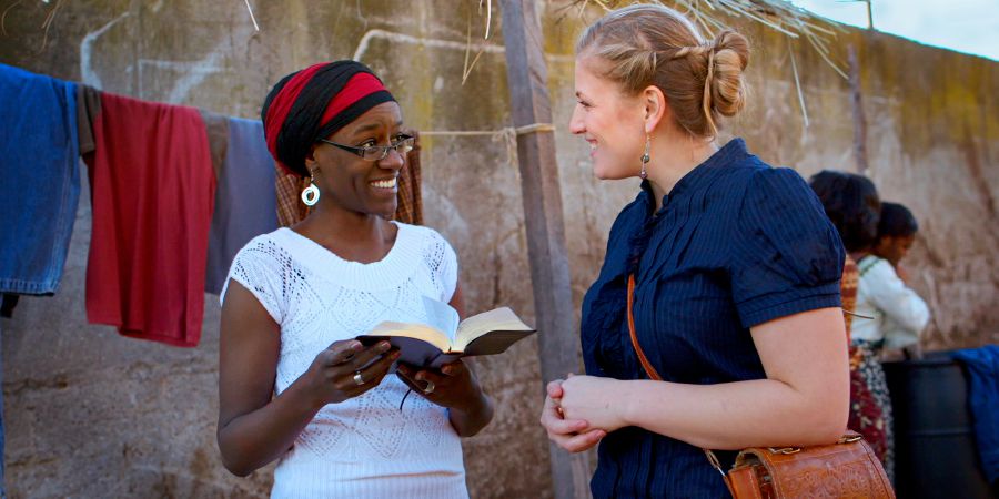 Cameron shares a Bible verse with a woman in Malawi