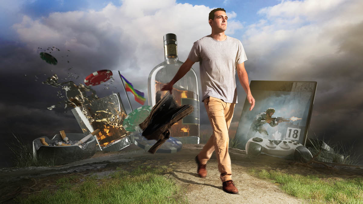 A Bible student walking on a path and throwing away an old garment. Behind him are cigarettes, alcoholic beverages, gambling chips, a flag symbolizing the gay social movement, and violent video games.