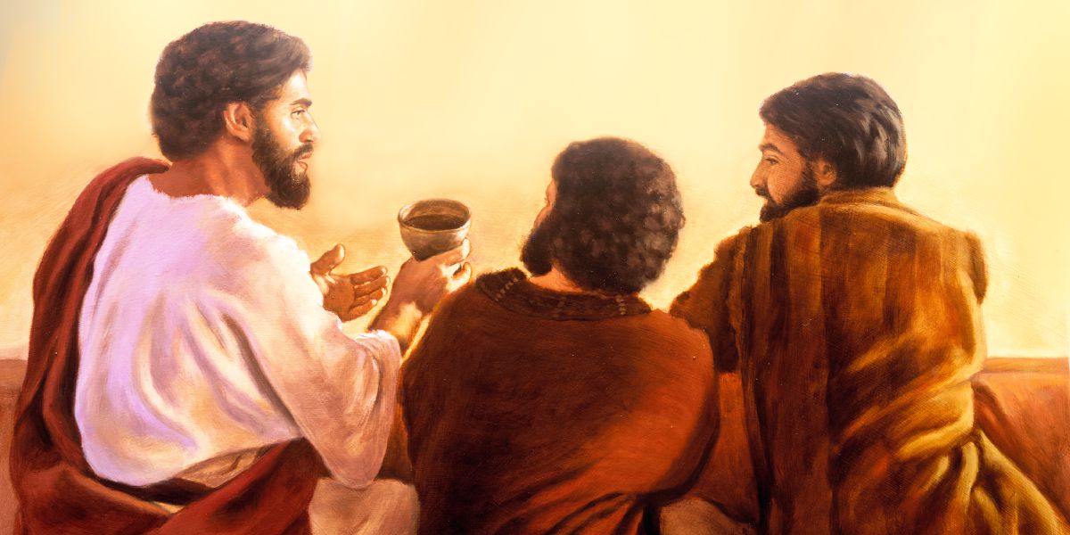 Jesus passes a cup of wine to two of his apostles