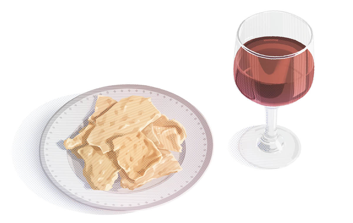 A plate of unleavened bread and a glass of wine.