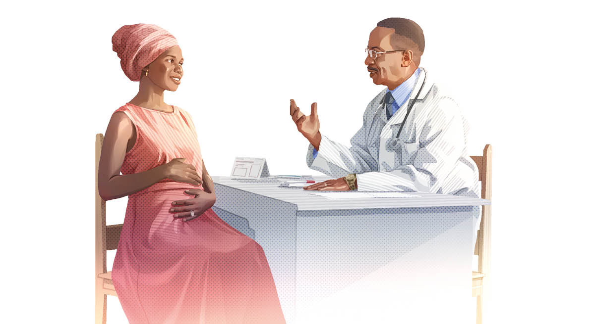 En gravid kvinde taler med sin læge.
