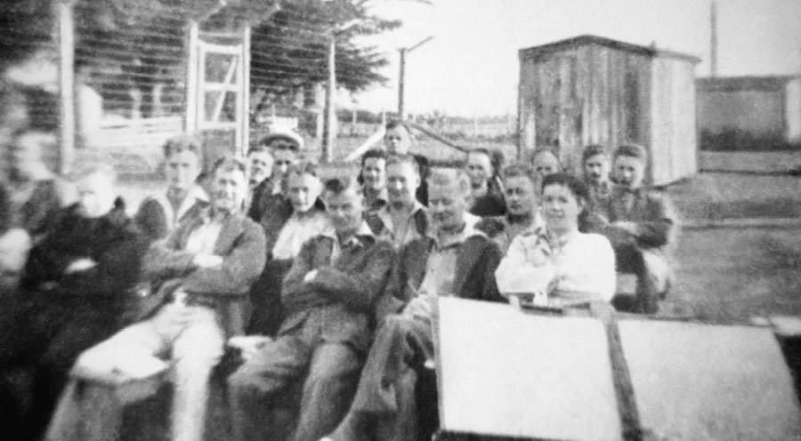 A group of Witnesses at a detention camp, attending the Theocratic Ministry School.