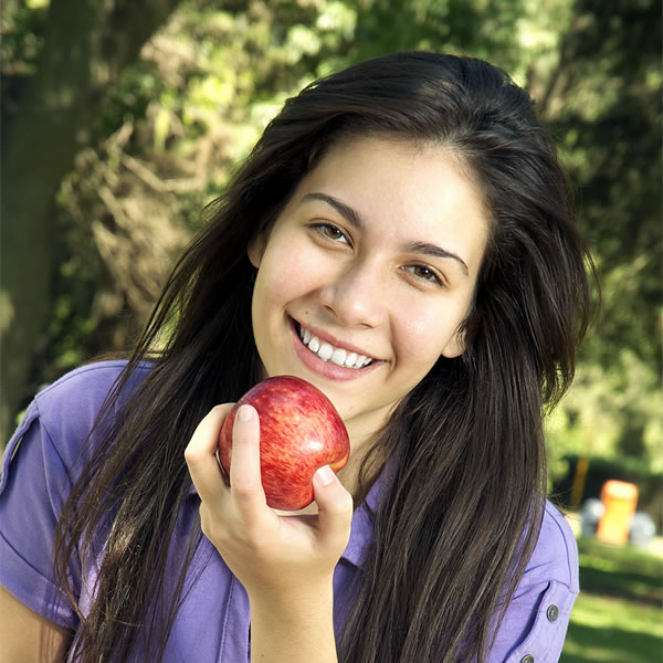 A girl eating an apple