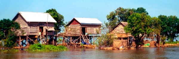 Houses raised on stilts over the water