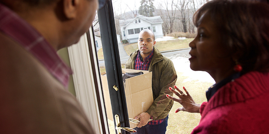 Parents open the door as their adult son moves back home