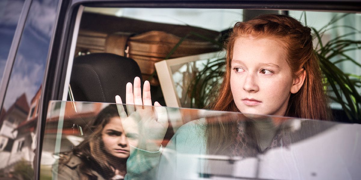 A young woman is sad to see her friend move away