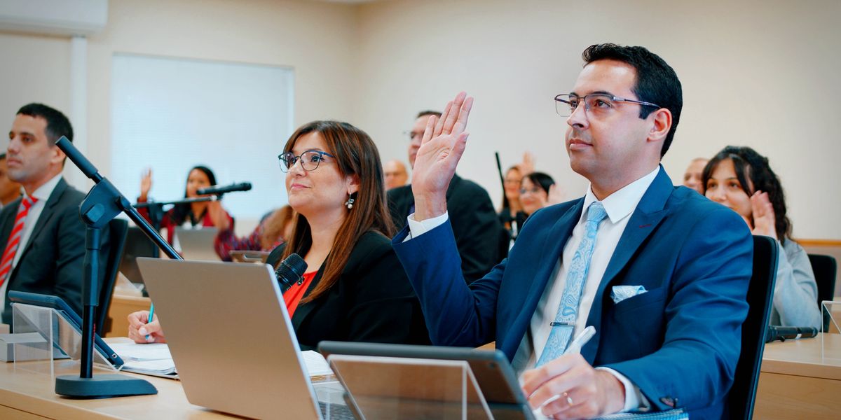 Students raising their hands to comment at the School for Kingdom Evangelizers.