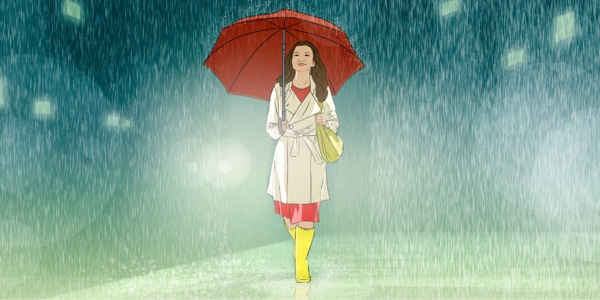 A teenage girl walking in the rain