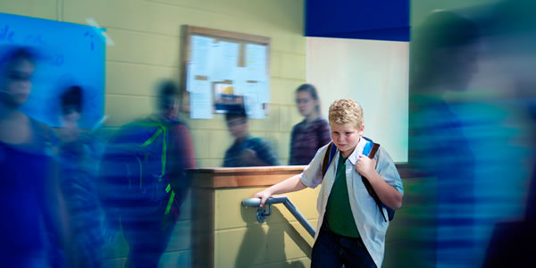 A teenage boy feeling anxious at school