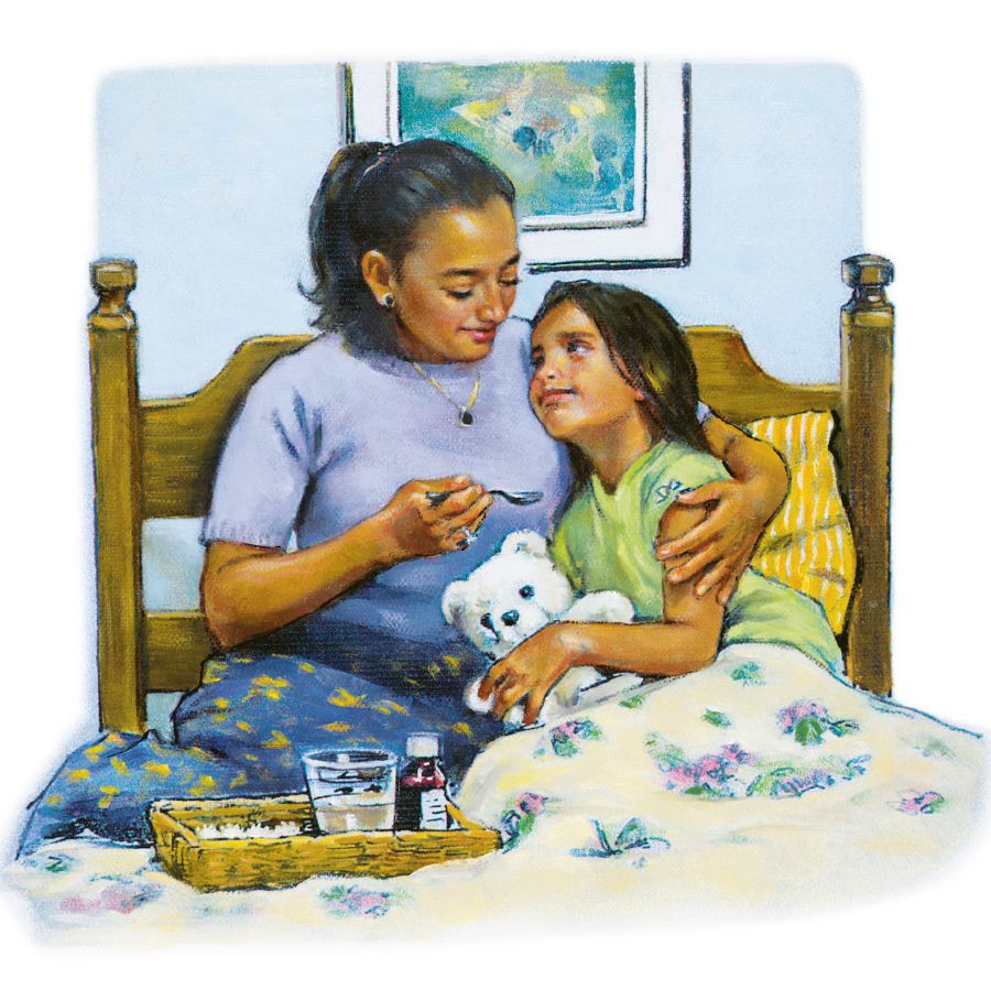A mother holds her sick daughter and gives her some medicine