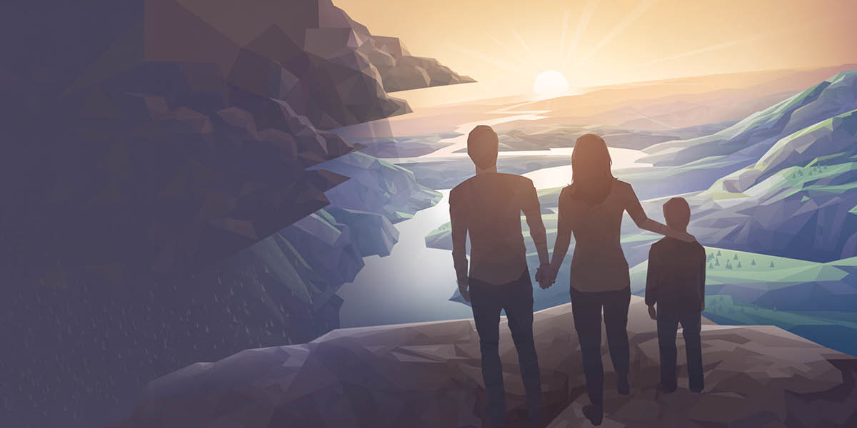 A couple and their young son standing on a mountain ledge above a peaceful river valley.