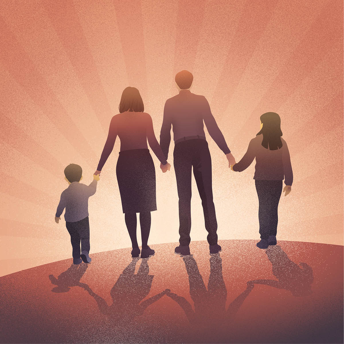 A family walking hand-in-hand and looking toward the horizon.