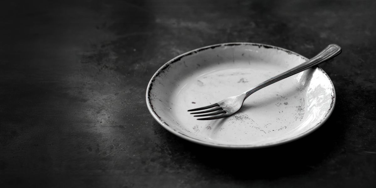 A fork on an empty plate.