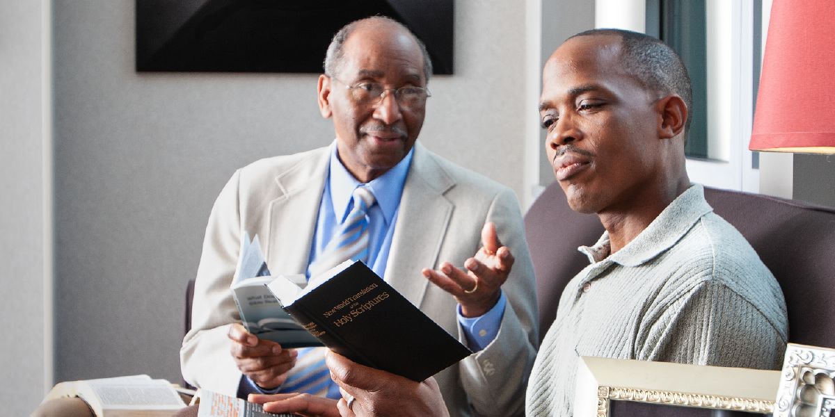 A brother talks with his Bible student
