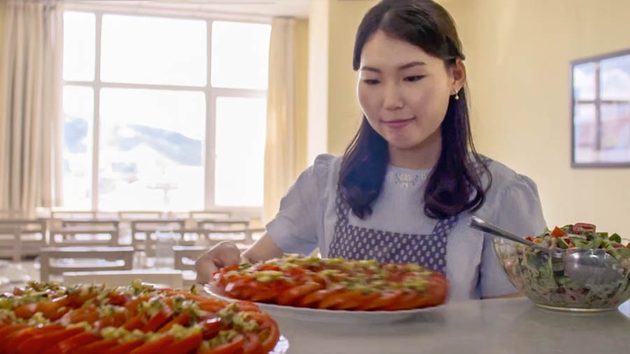 A scene from the video ‘Three Sisters in Mongolia.’ Oyun, one of the pioneer sisters, works in the dining room at Bethel.