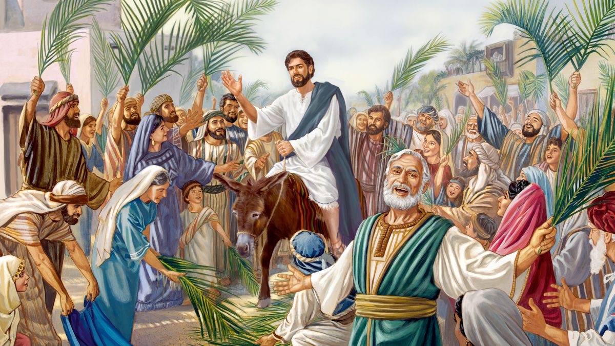 Jesus riding on a donkey’s colt while a joyous crowd places outer garments and palm branches on the road.