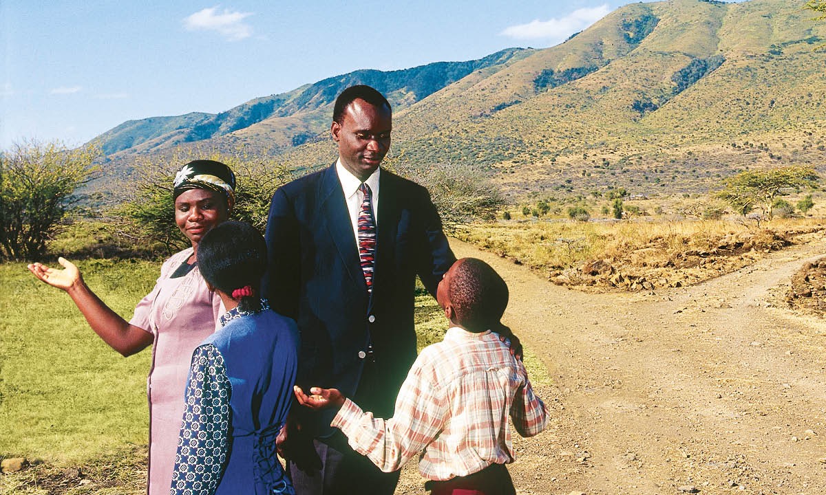 A family stands at a crossroad