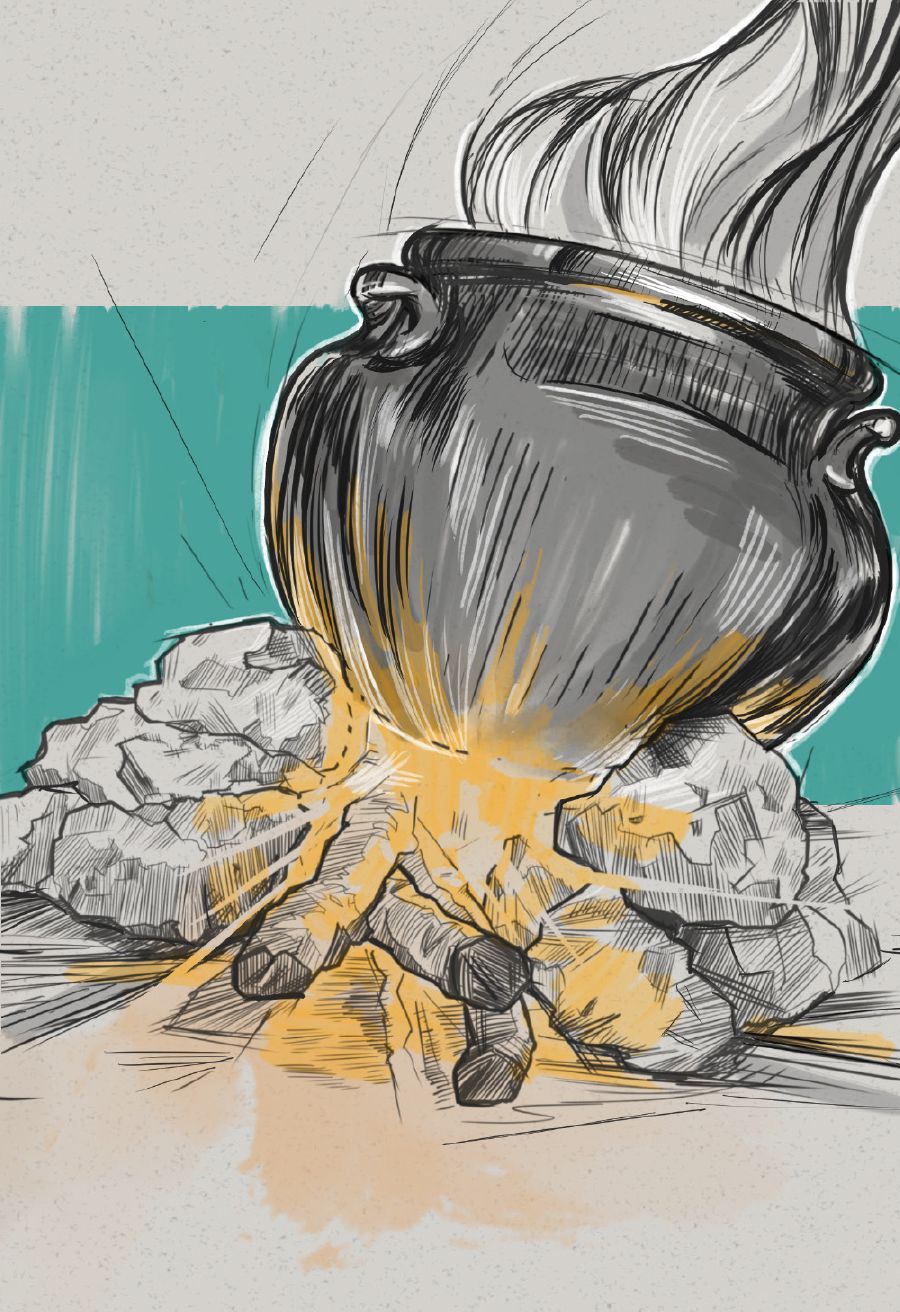 A cooking pot on top of a fire.