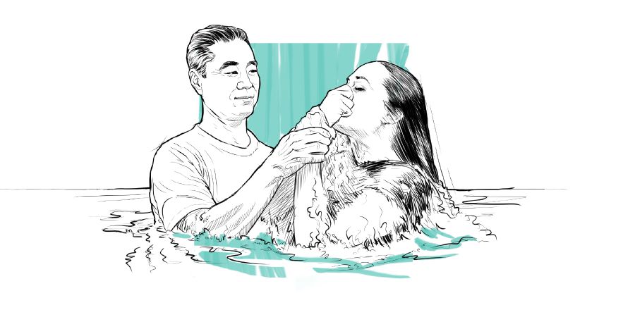 A woman getting baptized.