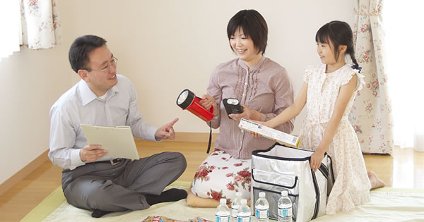 A family preparing an emergency kit