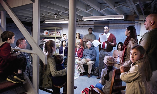A modern-day congregation meets secretly in a basement