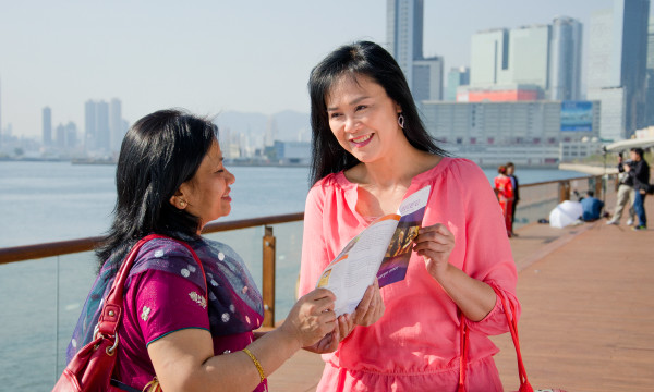 Cheri preaches to a woman