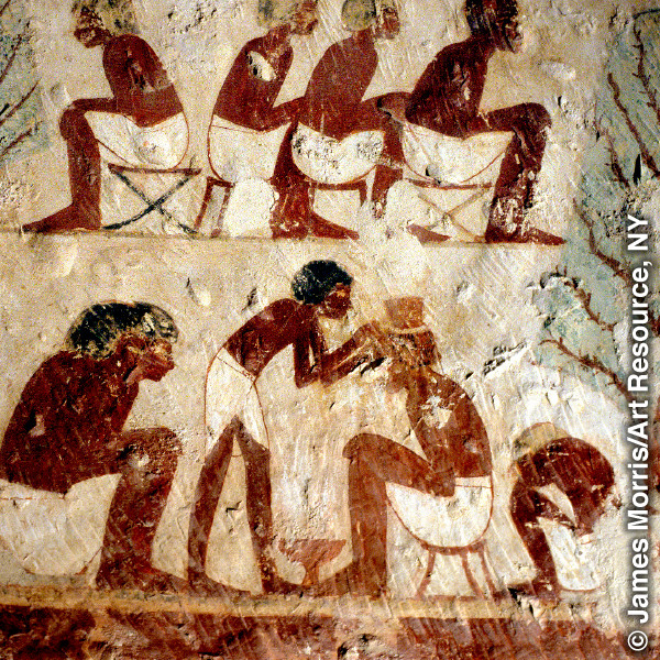 An ancient Egyptian wall painting that shows a barber at work