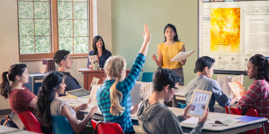 A young sister defends her faith in front of her class in school