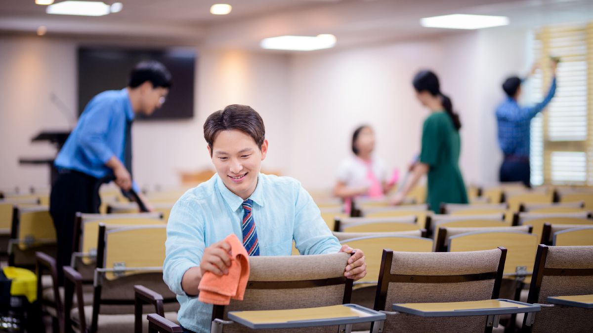 Brothers and sisters clean a Kingdom Hall