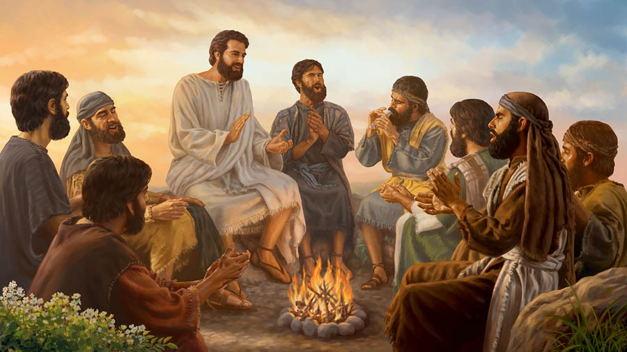 Jesus and some of his disciples sitting around a campfire. They sing and clap their hands as one of them plays the flute.