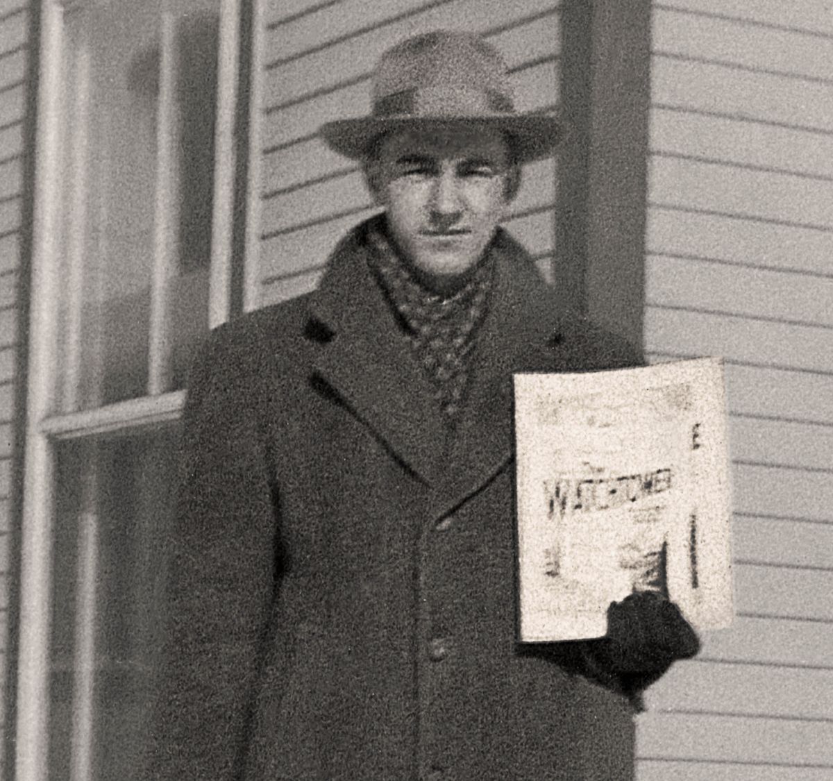 André holding an issue of “The Watchtower.”