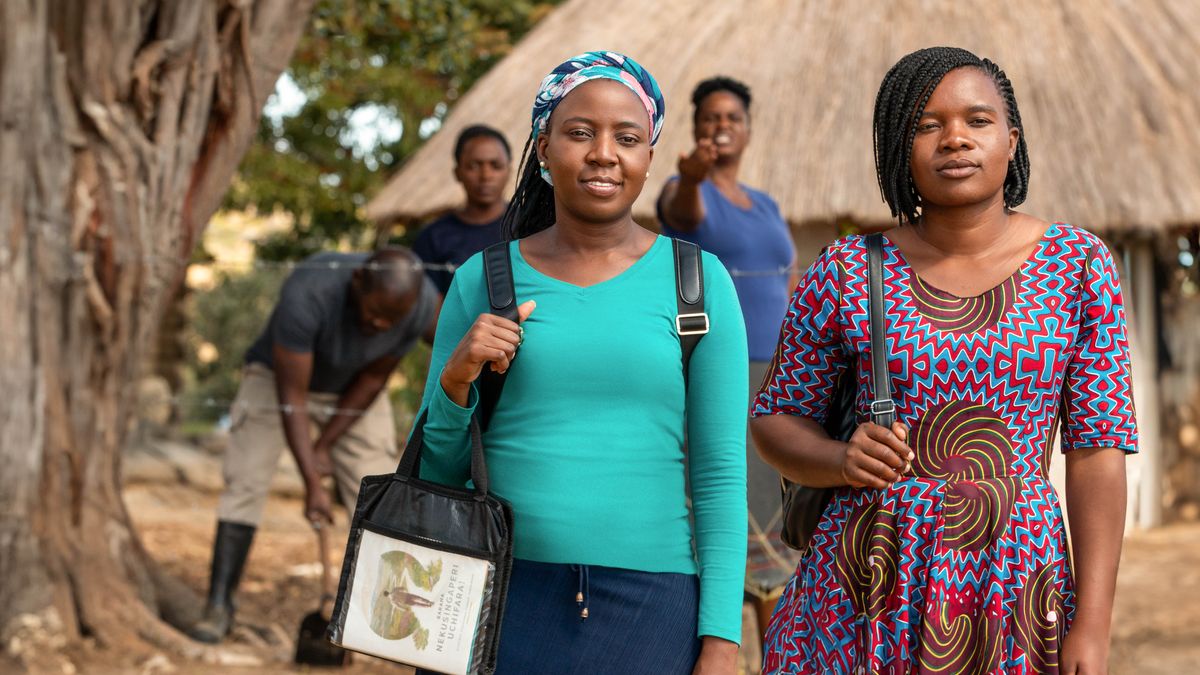 A reenactment of Prisca participating in the ministry with another sister. Prisca confidently looks ahead while her neighbors ridicule her.