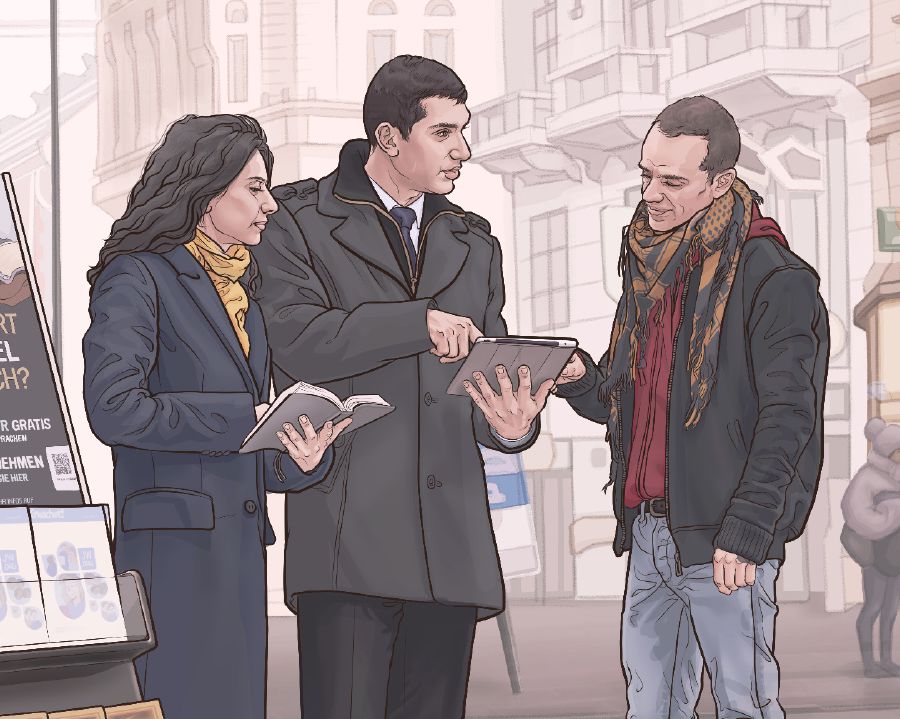 Jehovah’s Witnesses stand next to a public witnessing cart and preach to a man