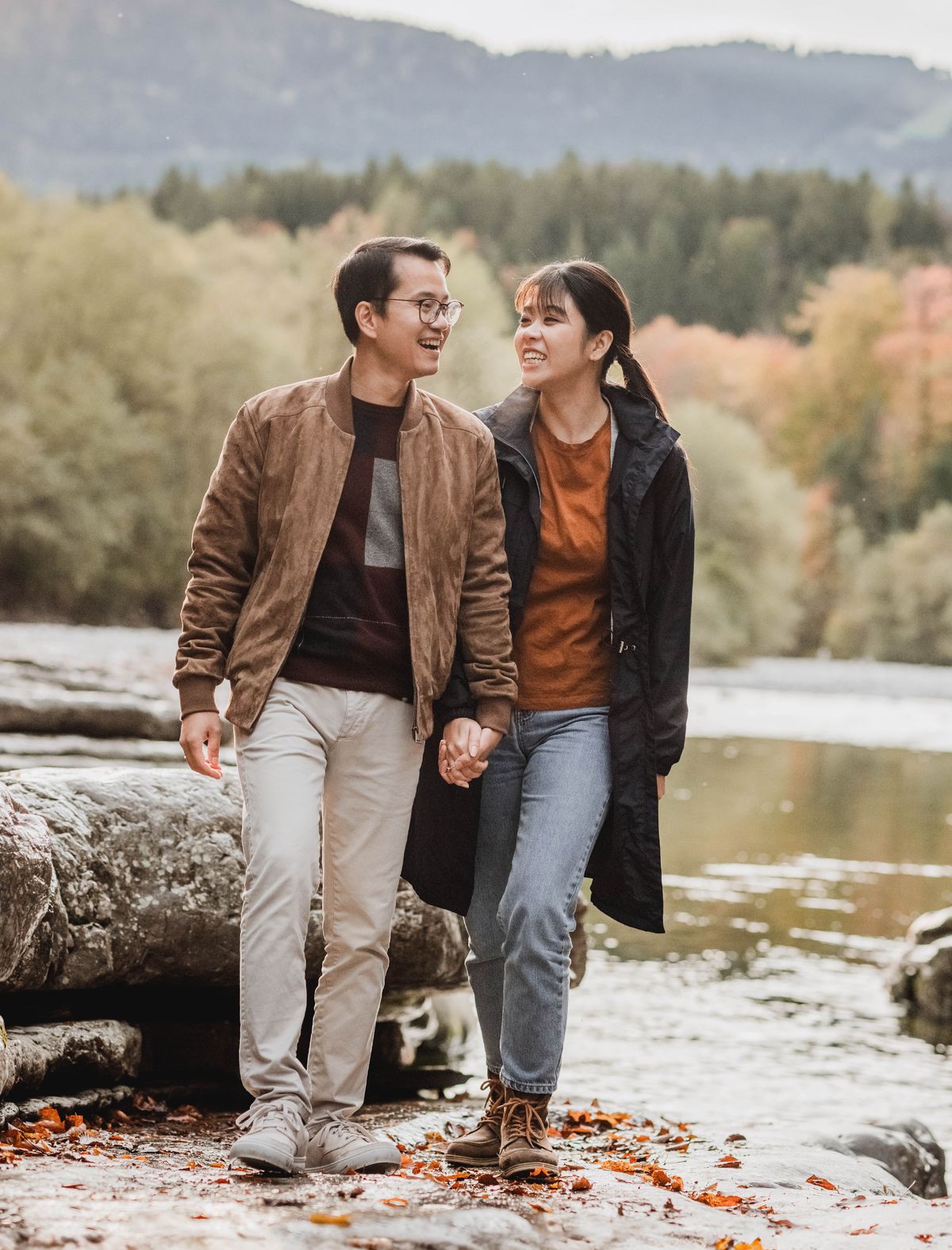 A couple walking outdoors and enjoying their time together.