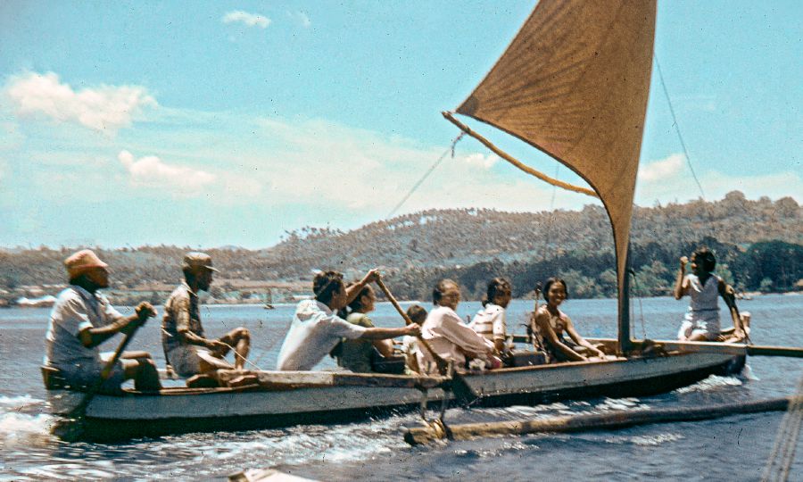 Publishers in a boat on their way to preach in Ambon, Maluku
