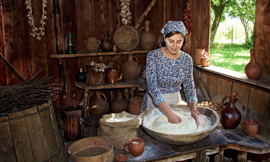 A woman makes bread