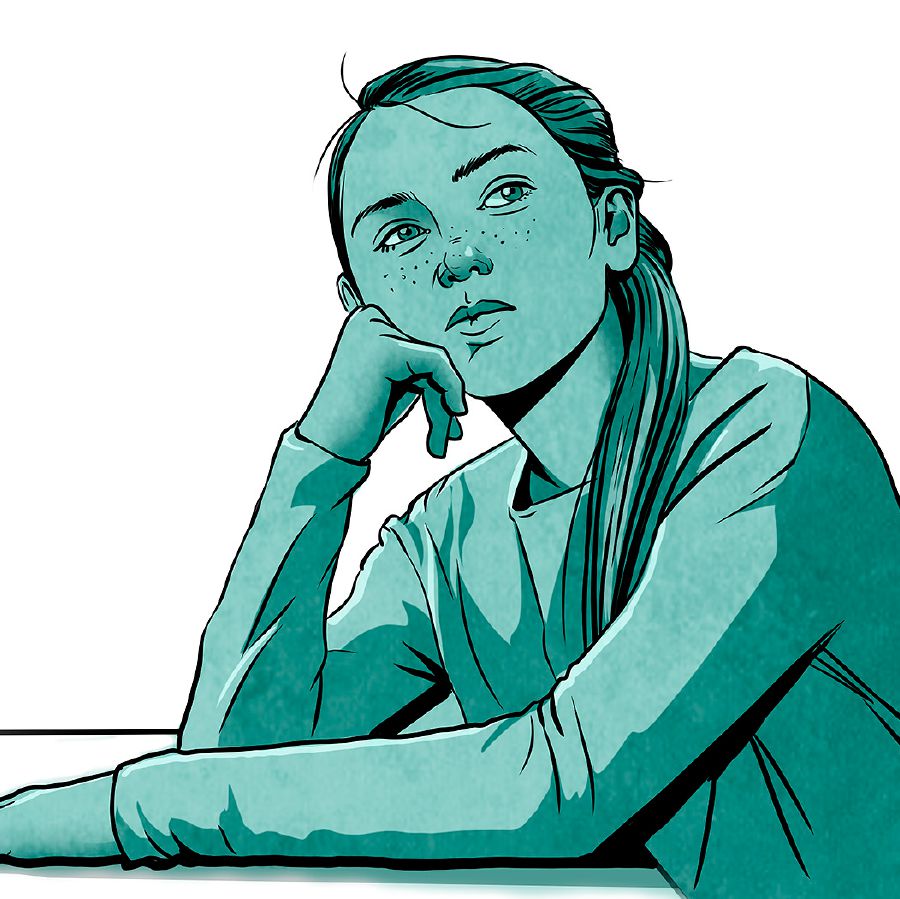 A teenage girl sits and thinks