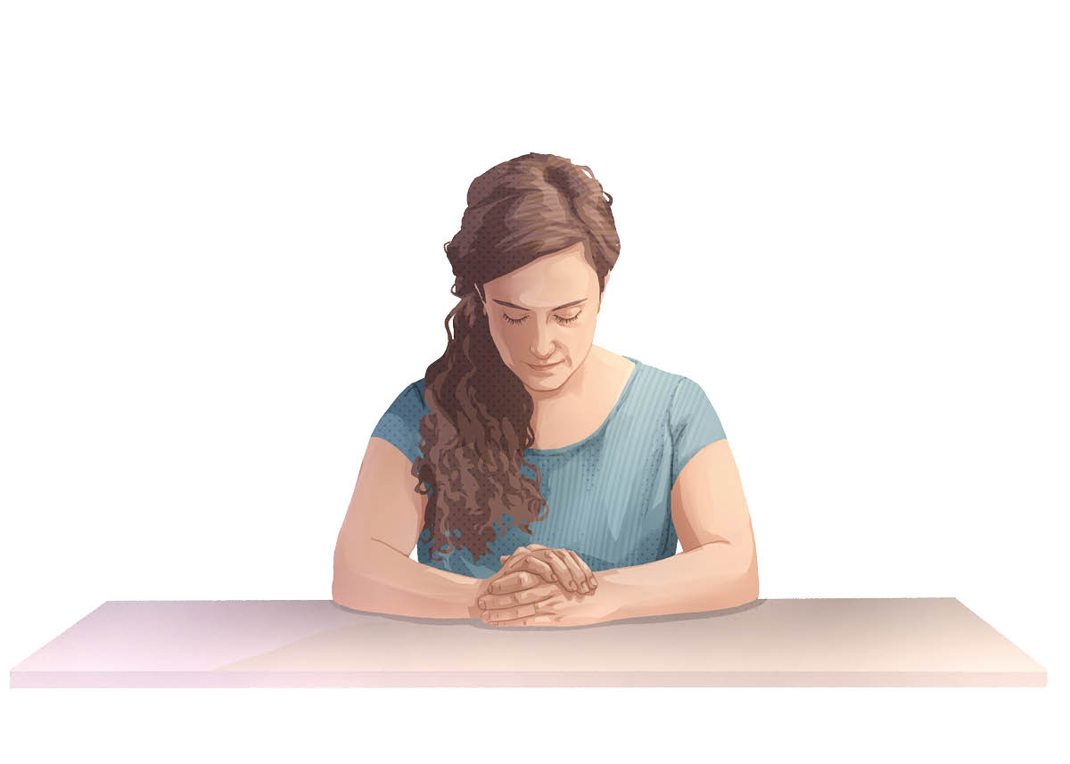 Une femme en train de prier.