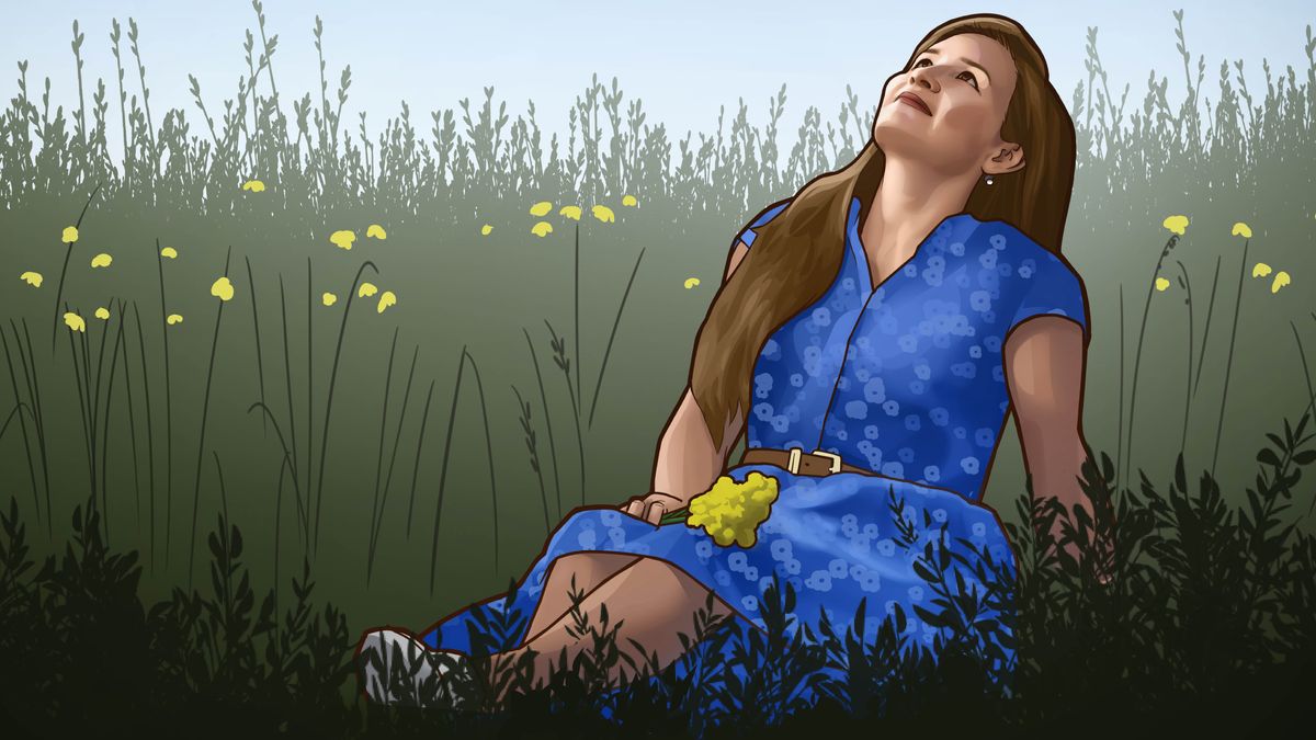 Una scena del video “Il mondo non può darti quello che non ha”. La sorella Gajnanšina è seduta in mezzo all’erba e osserva il cielo.