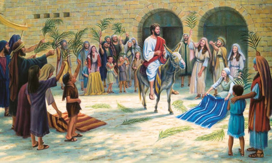 Quando Jesus entra em Jerusalém montado num jumento, as pessoas colocam capas e ramos no caminho
