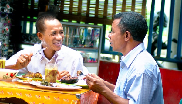 Nelson and Augusto eating a meal together