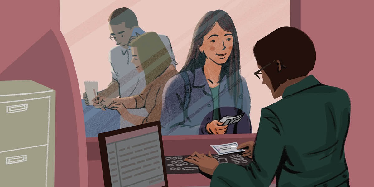 Una gióvena fà un pagamento nel banco