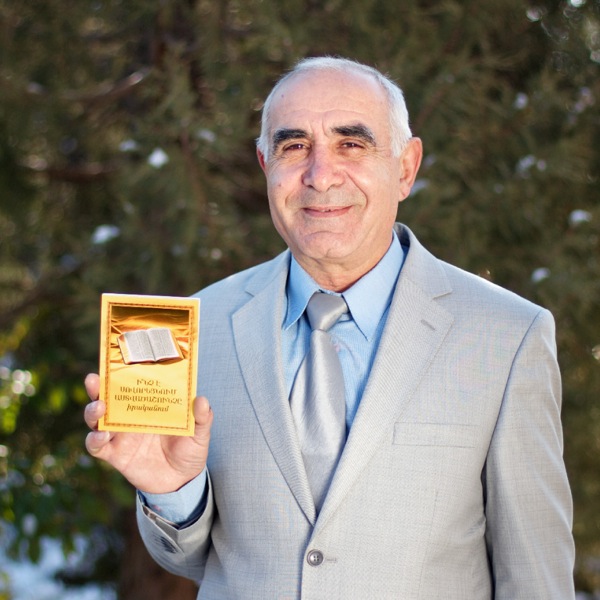 A man in Armenia holding a book translated by Jehovah’s Witnesses
