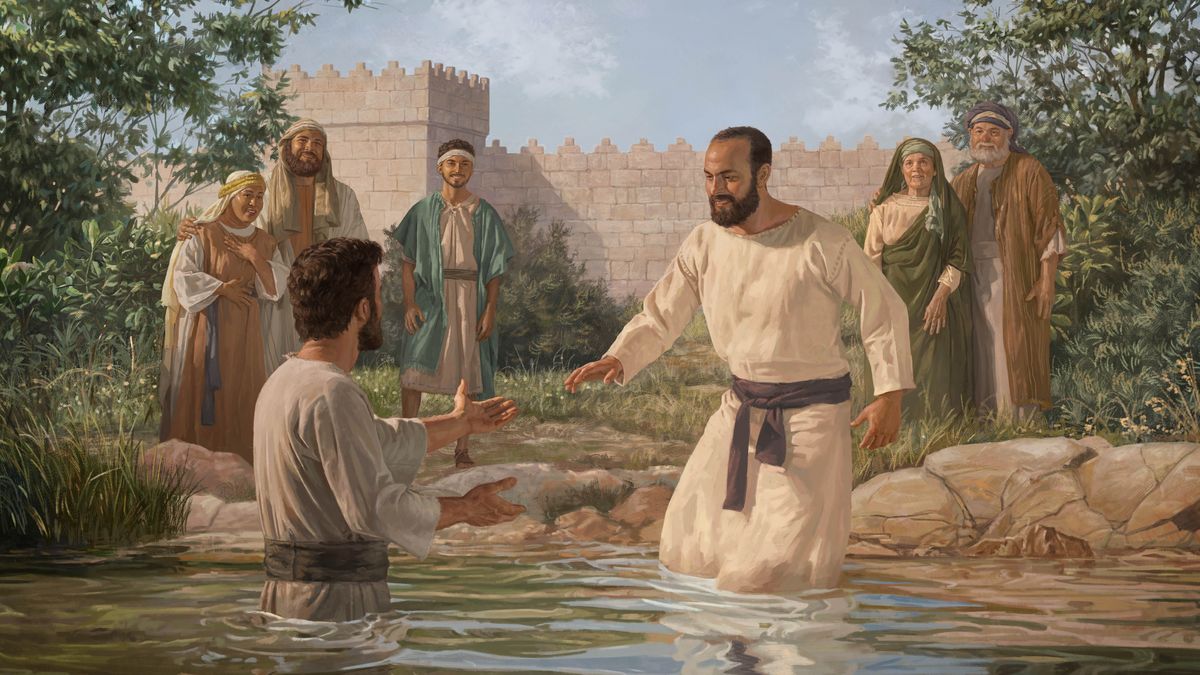 Saulo l’è drio ndar rento la àqua par esser batesà. Un per de persone le varda contente.