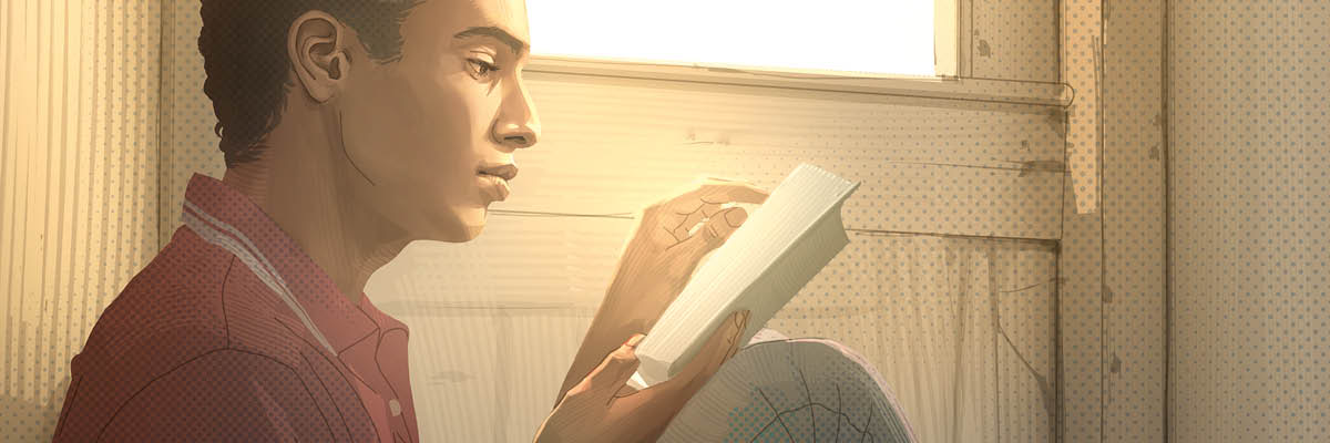 Seorang lelaki muda membaca Bible.